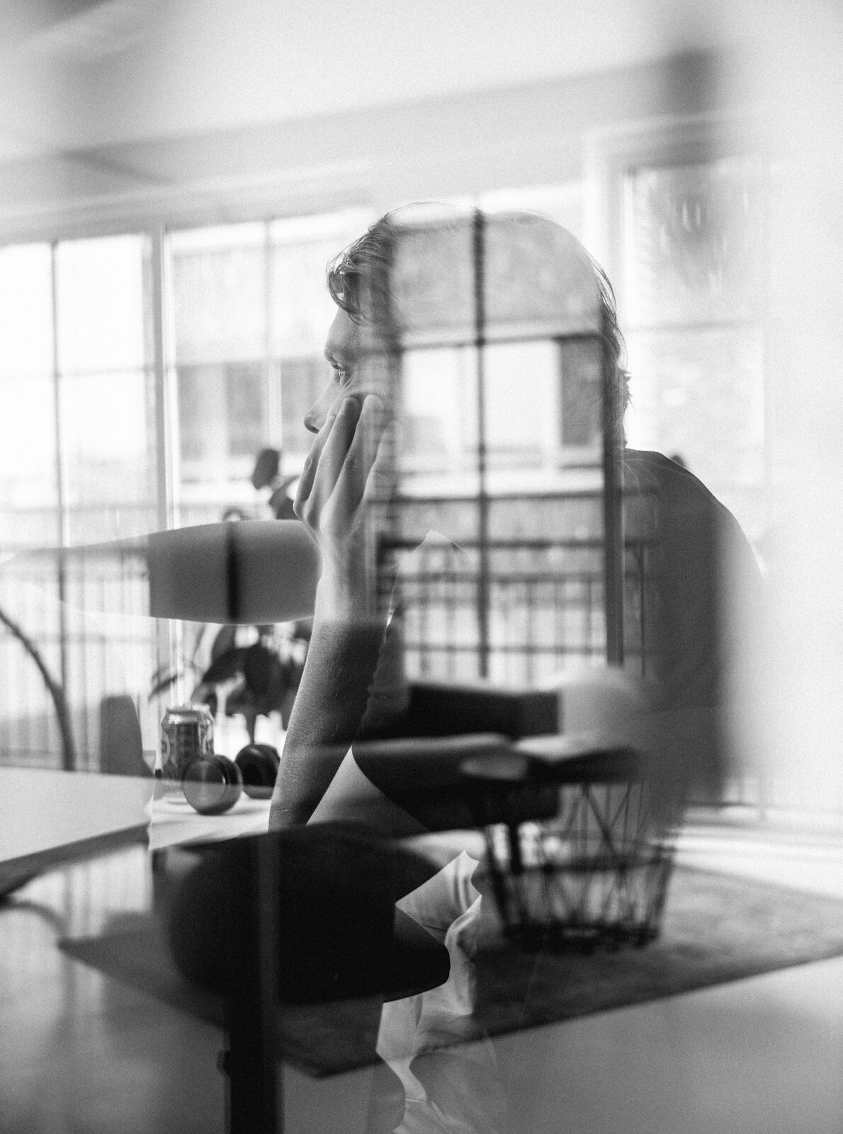 Double exposure black and white portrait of a business professional in thought - hitchAgentic strategic consulting